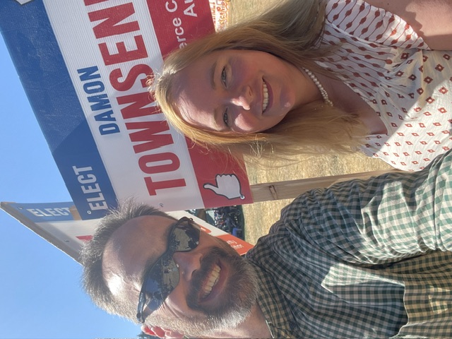 Damon and Dawn Townsend with a campaign sign